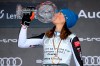 Slovakia's Petra Vlhova kisses the trophy of the alpine ski, women's World Cup overall title, in Lenzerheide, Switzerland, Sunday, March 21, 2021. (AP Photo/Marco Trovati)