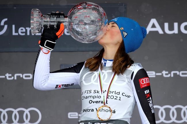 Slovakia's Petra Vlhova kisses the trophy of the alpine ski, women's World Cup overall title, in Lenzerheide, Switzerland, Sunday, March 21, 2021. (AP Photo/Marco Trovati)
