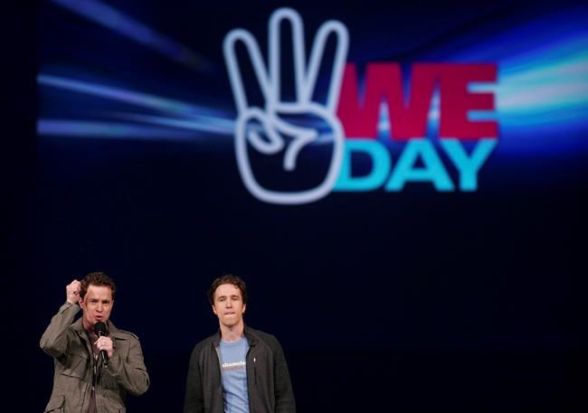Virgin Atlantic Airways says it is suspending its sponsorship of WE Charity amid an ongoing controversy over a deal to run a student-volunteer program. Marc, left, and Craig Kielburger, co-founders of the charity Free the Children, speak at the charity's We Day celebrations in Kitchener, Ont., Thursday, Feb. 17, 2011. THE CANADIAN PRESS/Geoff Robins