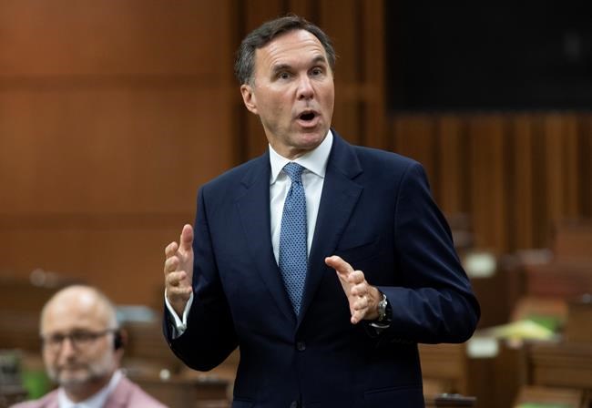 Prime Minister Justin Trudeau says he has full confidence in Finance Minister Bill Morneau and any reports to the contrary are false. Finance Minister Bill Morneau rises during Question Period in the House of Commons in Ottawa, Monday, July 20, 2020. THE CANADIAN PRESS/Adrian Wyld