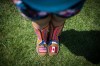 Red Moon Roberts, 16, from the Sto:lo Nation near Chilliwack, B.C., wears moccasins bearing the flags of the United States and Canada crafted from beads as she poses for a photograph before competing during the final day of the 32nd annual Squamish Nation Youth Powwow, in West Vancouver, B.C., on Sunday July 14, 2019. THE CANADIAN PRESS/Darryl Dyck