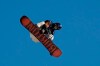A snowboarder practices for the Big Air Atlanta snowboard and ski competition at SunTrust Park Thursday, Dec. 19, 2019, in Atlanta. (AP Photo/John Bazemore)