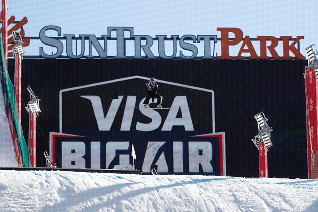A snowboarder practices for the Big Air Atlanta snowboard and ski competition at SunTrust Park Thursday, Dec. 19, 2019, in Atlanta. (AP Photo/John Bazemore)