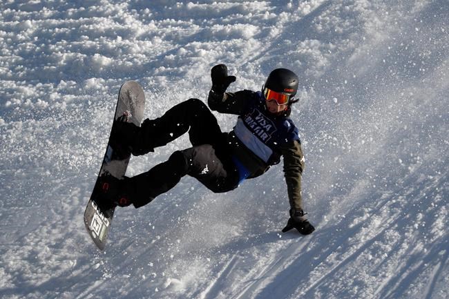A snowboarder practices for the Big Air Atlanta snowboard and ski competition at SunTrust Park, Thursday, Dec. 19, 2019, in Atlanta. (AP Photo/John Bazemore)