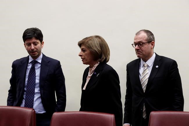 From left, Italy's Minister of Health Roberto Speranza, European Commissioner for Health Stella Kyriakides and World Health organization Director for Europe Hans Kluge arrive for a press conference at the end of their meeting in Rome, Wednesday, Feb. 26, 2020. (AP Photo/Gregorio Borgia)