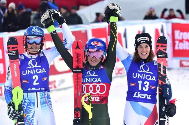 From left, second placed Slovakia's Petra Vlhova, first placed United States' Mikaela Shiffrin and third placed Switzerland's Michelle Gisin celebrate after completing an alpine ski, women's World Cup slalom in Lienz, Austria, Sunday Dec. 29, 2019. (AP Photo/Pier Marco Tacca)