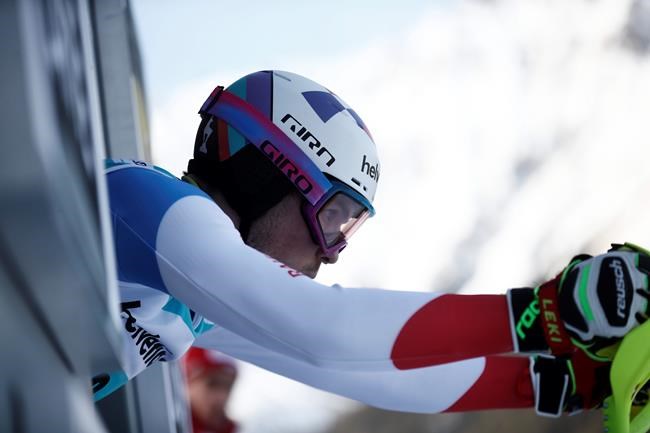 Switzerland's Daniel Yule prepares to start the second run of an alpine ski, World Cup Men's slalom in Adelboden, Switzerland, Sunday, Jan. 12, 2020. (AP Photo/Gabriele Facciotti)