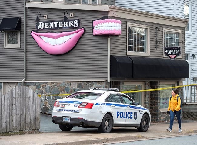The Atlantic Denture Clinic is guarded by police in Dartmouth, N.S. on Monday, April 20, 2020. The business is owned by alleged killer Gabriel Wortman. Police say 17 people are dead, including RCMP Const. Heidi Stevenson, after a man went on a murder spree in several Nova Scotia communities. Wortman, 51, was shot and killed by police. THE CANADIAN PRESS/Andrew Vaughan