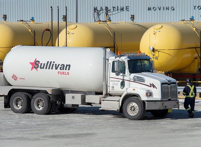 A driver heads to his propane truck after filling up in Dartmouth, N.S. on Friday, February 21, 2020. Rail service across the country has been disrupted by protests related to the construction of a natural gas pipeline in British Columbia and the supply of many commodities, including propane, has been severely impacted. THE CANADIAN PRESS/Andrew Vaughan