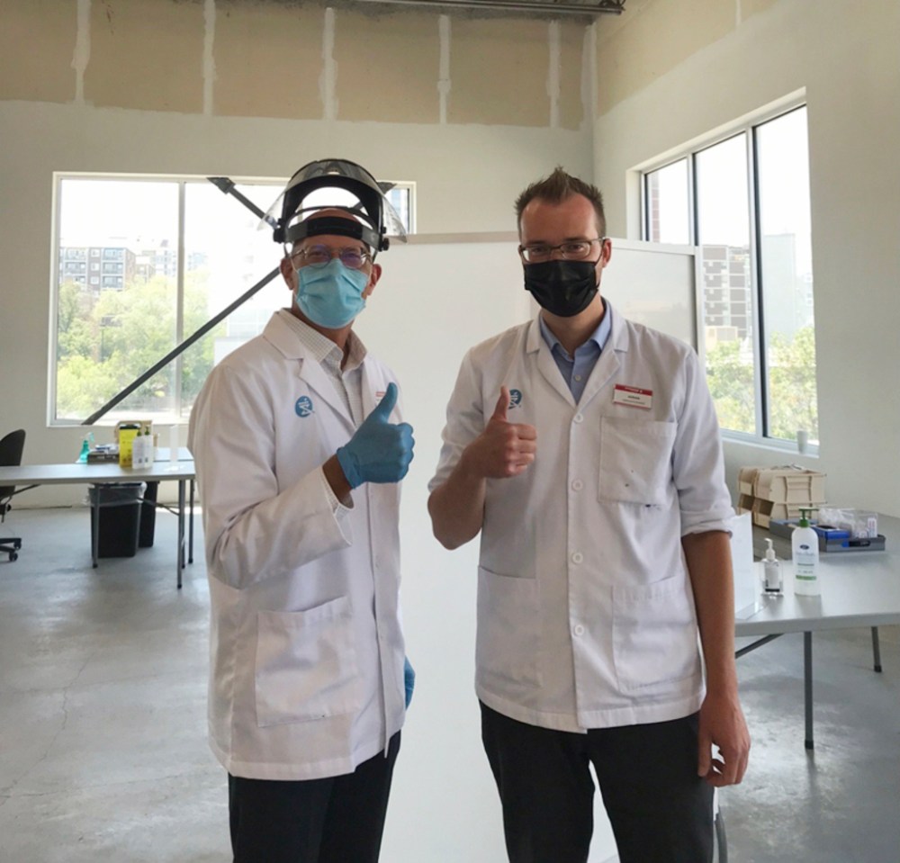 SUPPLIED 
Pharmacist and retired Shoppers Drug Mart owner Hans Epp (L) and Adrian Gulowaty, pharmacist-owner of the Osborne Village Shoppers location, at the store’s vaccine clinic.