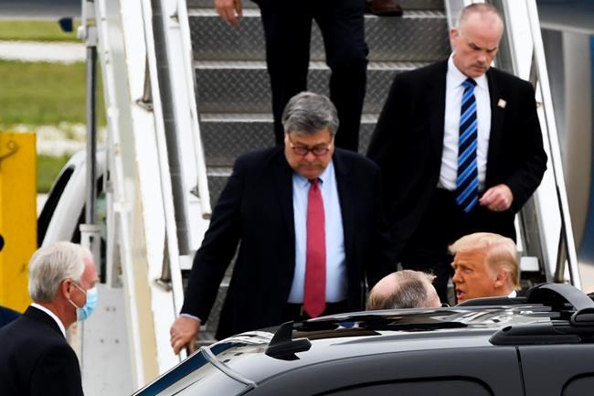 President Donald Trump, bottom right, and Attorney General William Barr, left, walk from Air Force One as they arrivea at Waukegan National Airport before attending a series of events in Kenosha, WI, Tuesday, Sept. 1, 2020, in Waukegan, IL. (AP Photo/Matt Marton)