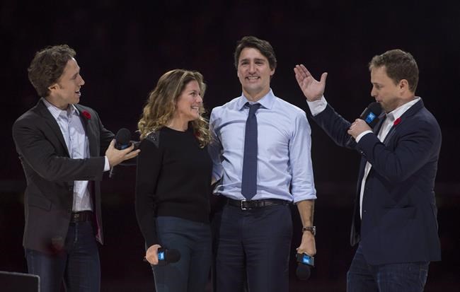 Co-founders Craig (left) and Marc Kielburger introduce Prime Minister Justin Trudeau and his wife Sophie Gregoire-Trudeau as they appear at the WE Day celebrations in Ottawa on November 10, 2015. The former chair of WE Charity’s board of directors says the board was explicitly told that speakers at the organization's popular youth events known as 'WE days' were not paid for speaking. Michelle Douglas, who resigned in March from the board of WE Charity, who is testifying today at the House of Commons finance committee, and says the board made direct inquiries about whether speakers for WE days were paid, and says the organization's executive director assured the board that they were not. WE organization confirmed earlier this month it has paid hundreds of thousands of dollars in speaking fees to members of Prime Minister Justin Trudeau's family. THE CANADIAN PRESS/Adrian Wyld