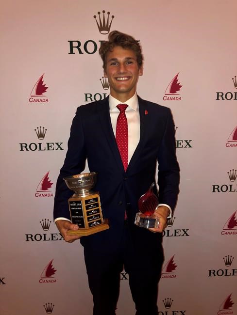 James Juhasz poses with the Nathan R. Cowan award from Sail Canada at an awards dinner in Toronto in this March 6, 2020 handout photo. At 20, promising Canadian sailor James Juhasz was already targeting the 2024 Olympics. While no one knows what the Olympic landscape looks like today, Juhasz is already dealing with challenges and hardships trying to keep his Olympic dream alive. THE CANADIAN PRESS/HO - James Juhasz