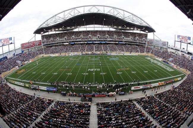 Investors Group Field is shown during opening kickoff for the CFL game between the Winnipeg Blue Bombers and Montreal Alouettes in Winnipeg on June 27, 2013. A bidding war erupted Monday as the governments of Manitoba and Saskatchewan offered up public money to convince the Canadian Football League to set up a one-city, abbreviated season.THE CANADIAN PRESS/John Woods