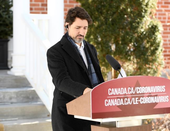 Prime Minister Justin Trudeau arrives to speak at a press conference on COVID-19 at Rideau Cottage, his residence on the grounds of Rideau Hall in Ottawa, on Saturday, March 21, 2020. THE CANADIAN PRESS/Justin Tang