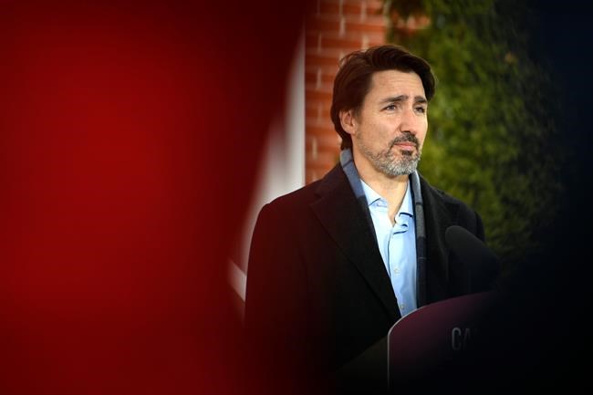 Prime Minister Justin Trudeau speaks during his daily press conference on COVID-19, in front of his residence at Rideau Cottage, on the grounds of Rideau Hall in Ottawa, on Saturday, March 28, 2020. THE CANADIAN PRESS/Justin Tang