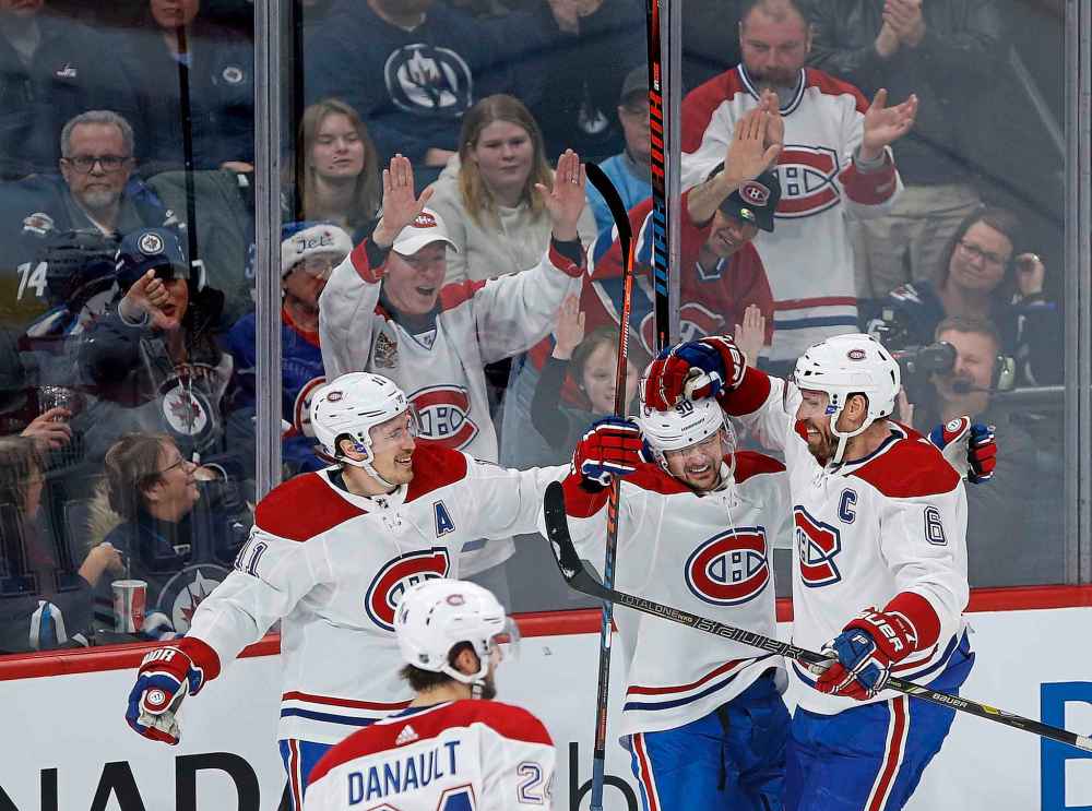 JOHN WOODS / WINNIPEG FREE PRESS FILES
Montreal Canadiens' players celebrate a goal against the Jets during the first period of their game on December 23 in Winnipeg.
