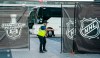 A security guard opens a gate for an empty player bus as it departs the Scotiabank Arena in Toronto on Thursday, Aug. 27, 2020. The professional sports schedule is expected to start getting busier on Friday after a string of postponements the past two days, but it won't be back to normal just yet. THE CANADIAN PRESS/Frank Gunn
