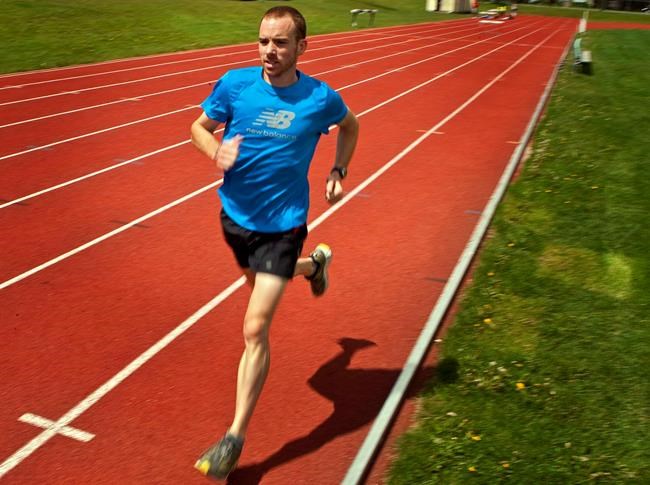 Marathon runner Reid Coolsaet, from Hamilton, Ont., trains in Calgary, Alta., Wednesday, Dec. 15, 2010. Changes in Tokyo Olympic qualifying dates have Canada's marathoners rearranging their race calendars. THE CANADIAN PRESS/Jeff McIntosh