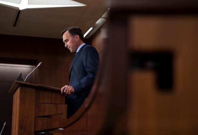 Minister of Finance Bill Morneau announces his resignation during a news conference on Parliament Hill in Ottawa, on Monday, Aug. 17, 2020. Canada's election watchdog says former finance minister Bill Morneau broke the law when he promoted Liberal candidates at events he attended while in charge of the finance portfolio. THE CANADIAN PRESS/Justin Tang