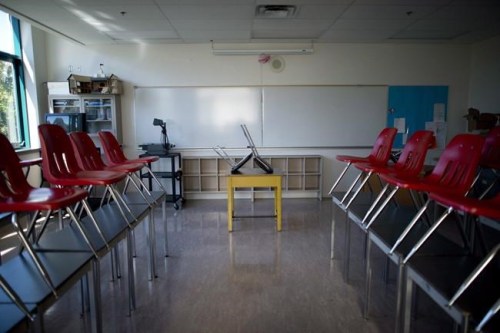 A empty classroom is pictured at McGee Secondary school in Vancouver, B.C. Friday, Sept. 5, 2014. Some private schools afraid they'd be blamed if a student gets COVID-19 are considering waivers to absolve them, but experts say that wouldn't stop a parent from suing or a school from racking up legal bills. THE CANADIAN PRESS/Jonathan Hayward