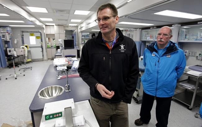 Director of medical services for VANOC, Dr. Mike Wilkinson, left, and mobile unit manager Dr. Ross Brown speak to reporters in a mobile medical unit setup at the Whistler Athletes' Village for the Vancouver 2010 Winter Olympic Games in Whistler, B.C., on Wednesday January 20, 2010. Canada's Olympic team doctor believes the Tokyo Games can happen in 2021 without a COVID-19 vaccine, but with major modifications. THE CANADIAN PRESS/Darryl Dyck
