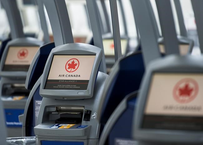 An Air Canada worker clean her ticketing station at Pearson International Airport in Toronto on Wednesday, April 8, 2020. Air Canada has the second-highest number of complaints about refunds to the U.S. Department of Transportation of any airline, including American ones. THE CANADIAN PRESS/Nathan Denette