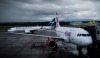 A Westjet Boeing 737-800, left, taxis past an Air Canada Rouge Airbus A319 at Vancouver International Airport in Richmond, B.C., on Monday, April 28, 2014. A new poll suggests turbulence ahead when it comes to the airlines winning public support for their current COVID-19 plans. THE CANADIAN PRESS/Darryl Dyck