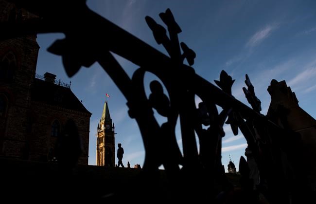 The Peace Tower on Parliament Hill in Ottawa is seen, in the midst of the COVID-19 pandemic, on Saturday, April 18, 2020. Justin Trudeau's ethical conduct will be put under an opposition microscope today during a rare summer sitting of the House of Commons, but the prime minister won't be there. THE CANADIAN PRESS/Justin Tang