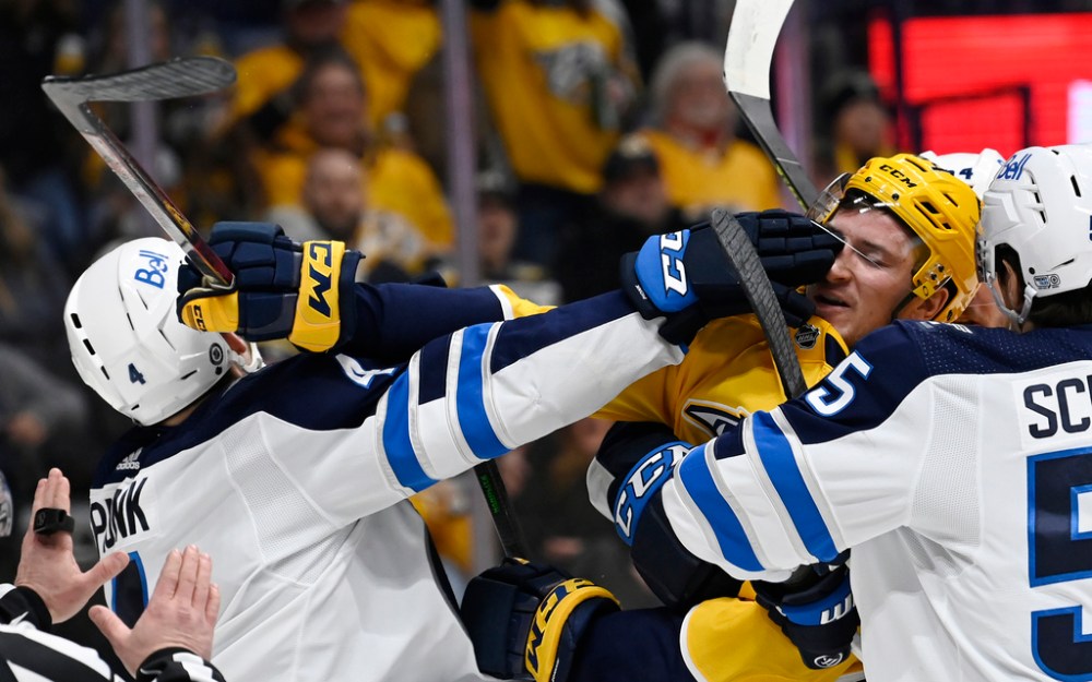CP
Things got a little testy between Neal Pionk (left) and Nashville's Tanner Jeannot during the second period on Thursday. (Mark Zaleski / The Associated Press files)
