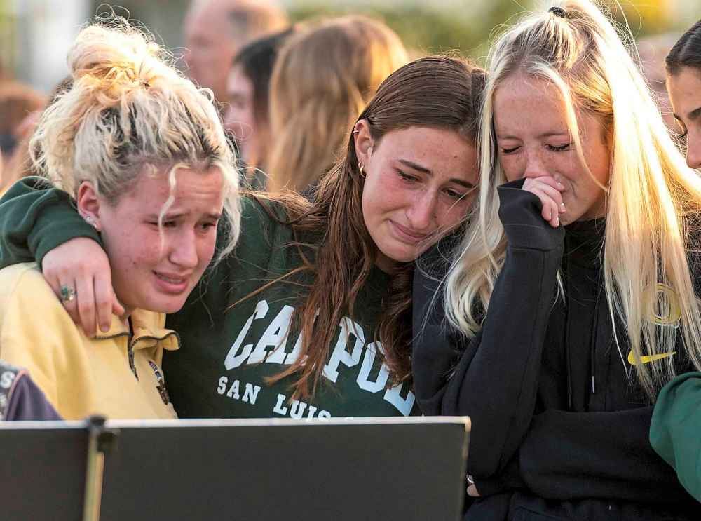 Friends and classmates of Alyssa Altobelli grieve as they look at photos of her during a vigil on Thursday. Alyssa and her parents, John and Keri Altobelli, were among the nine who died in the helicopter crash in Calabasas on Sunday. (Leonard Ortiz / The Orange County Register)