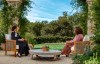 This image provided by Harpo Productions shows Meghan, The Duchess of Sussex, left, in conversation with Oprah Winfrey. (Joe Pugliese/Harpo Productions via AP)
