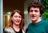 FILE - In this Thursday April 28, 2016 file photo, former champion Nino Salukvadze, left, and her son Tsotne Machavariani pose for a photo during an interview with the Associated Press in Tbilisi, Georgia. Even if it takes an extra year, Salukvadze will still be aiming for an Olympic record. The Georgian shooter has competed at every Olympics since 1988, where she won a gold medal for the Soviet Union. At the Tokyo Olympics — now postponed until 2021 because of the coronavirus pandemic — she will set a women's record of nine appearances. (AP Photo/Shakh Aivazov, file)