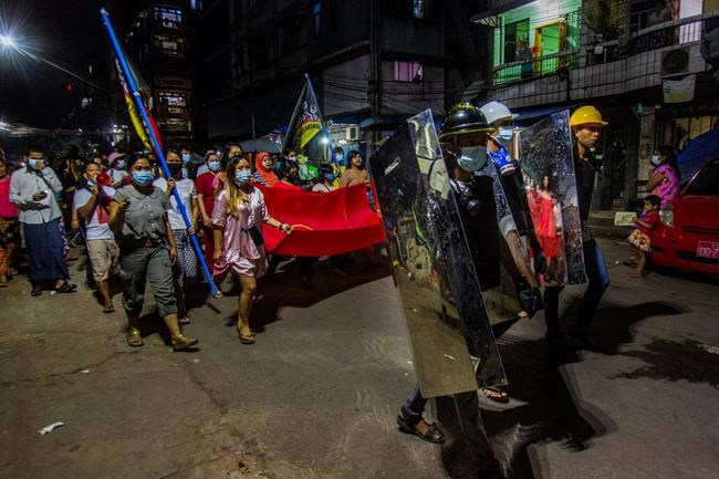 Residents march around their neighborhood despite an overnight curfew in an anti-coup night rally at the Myaynigone area of Sanchaung township in Yangon, Myanmar Monday, March 15, 2021. Myanmar's ruling junta has declared martial law in a wide area of the country's largest city Yangon, as security forces killed dozens of protesters over the weekend in an increasingly lethal crackdown on resistance to last month's military coup. (AP Photo)
