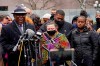 Katie Wright, center, the mother of Daunte Wright, and other family and friends gather during a news conference Tuesday, April 13, 2021, in Minneapolis as family attorney Ben Crump, left, speaks. Daunte Wright, 20, was shot and killed by police Sunday after a traffic stop in Brooklyn Center, Minn. (AP Photo/Jim Mone)