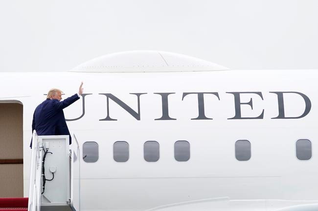 President Donald Trump waves from the top of the steps of Air Force One at Andrews Air Force Base in Md., Tuesday, Sept. 1, 2020. Trump is heading to Kenosha, Wics., to meet with law enforcement. (AP Photo/Susan Walsh)