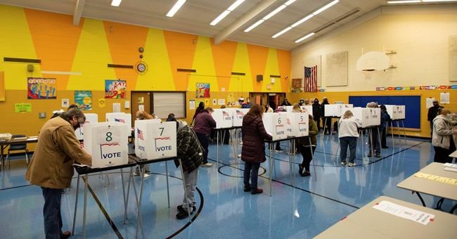 Voters cast their ballots on Election Day, Tuesday, Nov. 3, 2020, at Willow School in Lansing, Mich. (Matthew Dae Smith /Lansing State Journal via AP)