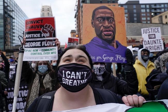Protesters rally outside the 3rd Precinct Monday, April 19, 2021, in Minneapolis as the murder trial against the former Minneapolis police officer Derek Chauvin in the killing of George Floyd advances to jury deliberations. (AP Photo/Morry Gash)