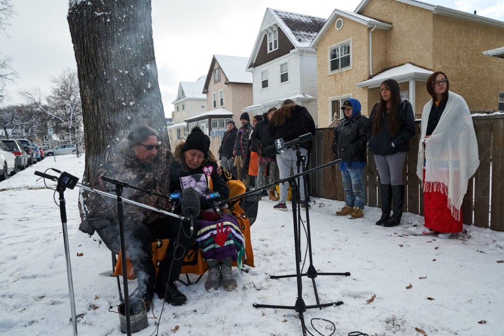 Family and friends of 11-month-old Anthony Dethmers and his mother Jennifer Dethmers speak at a press conference on Wednesday. (David Lipnowski / The Canadian Press files)