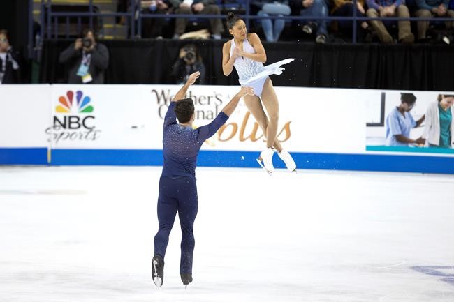 Jessica Calalang and Brian Johnson compete in the senior pairs free skate program at the U.S. Figure Skating Championships, Saturday, Jan. 25, 2020, in Greensboro, N.C. (AP Photo/Lynn Hey)