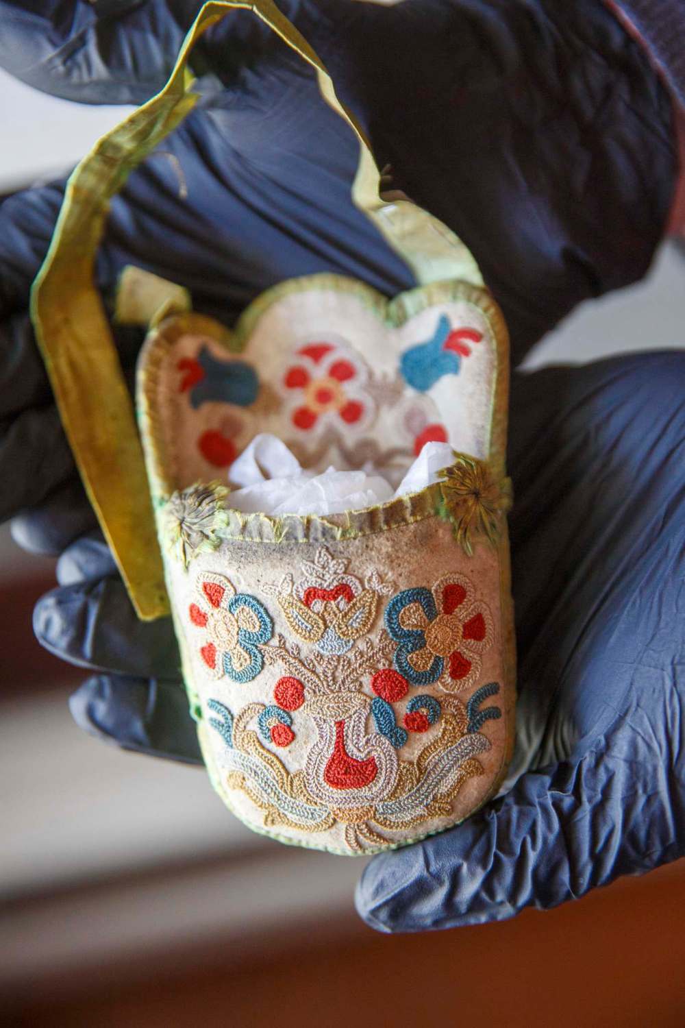 A silk thread on caribou leather watch pocket made by Harriet Inkster. (Mike Deal / Winnipeg Free Press)