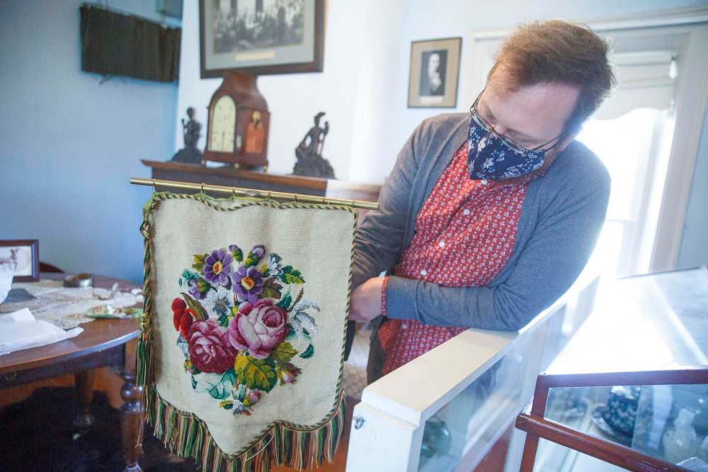 A fire screen made with bead and wool embroidery from the late 19th century on display. (Mike Deal / Winnipeg Free Press)
