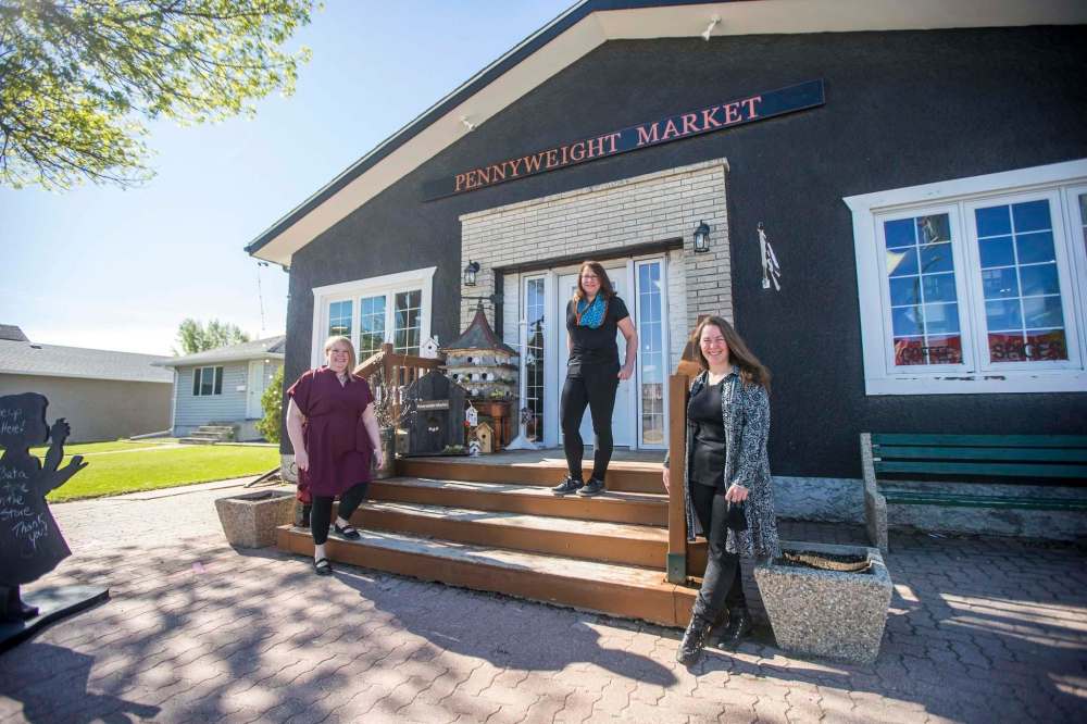 Pennyweight Market owners Kim Friesen (left), Laurie McLean, and Andrea Swain outside the shop. (Mikaela MacKenzie / Winnipeg Free Press)