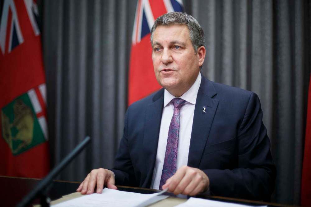 As various anti-Bill 64 signs pop up on lawns across the province, Education Minister Cliff Cullen has suggested a vocal minority opposes the reforms and is spreading misinformation about them. (Mike Deal / Winnipeg Free Press files)