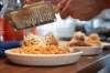 ALEX LUPUL / WINNIPEG FREE PRESS
Kyle Lew grates Pecorino over his homemade pasta and meatballs.