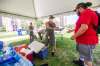 MIKAELA MACKENZIE / WINNIPEG FREE PRESS Vincent Lillie, with the DCSP, gives free water to folks at Central Park Friday during the summer's first significant heatwave.