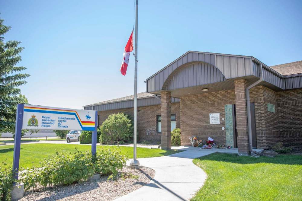 A makeshift memorial for Const. Shelby Patton is laid out beside the Indian Head RCMP detachment in Indian Head, Sask., on Sunday.  (Kayle Neis / The Canadian Press)