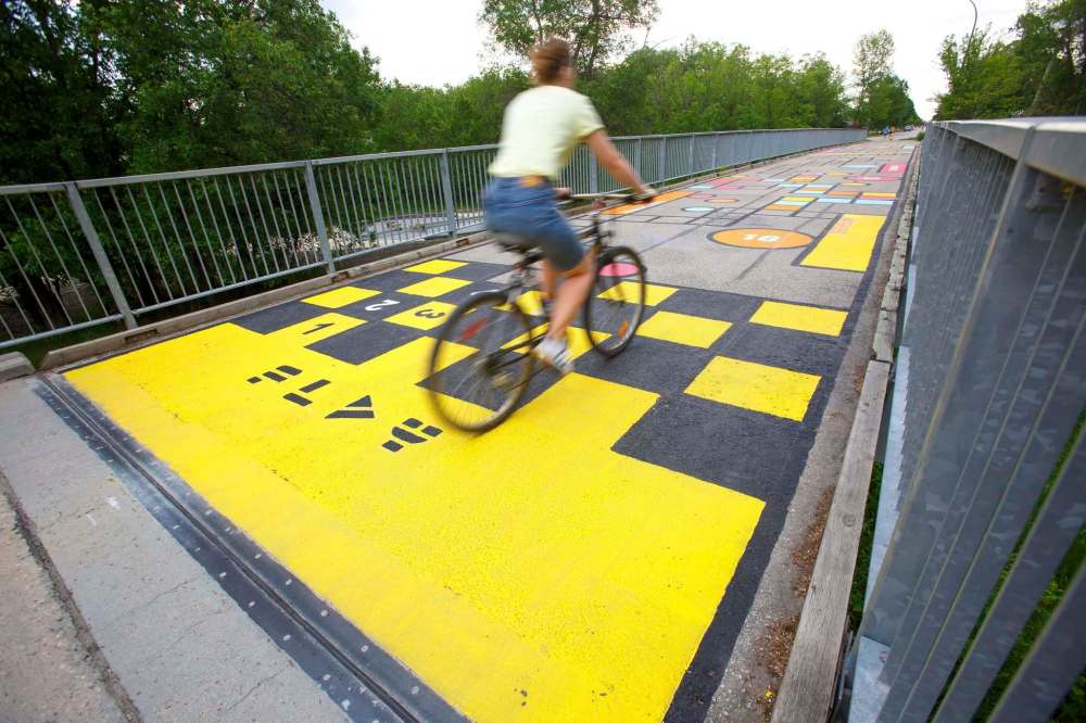 Five pedestrian bridges look a lot brighter this week thanks to a fresh coat of paint and creativity. Four bridges spanning the Seine River and one spanning Bunn’s Creek are being treated to a makeover courtesy of Cool Streets Winnipeg, (Mike Deal / Winnipeg Free Press)