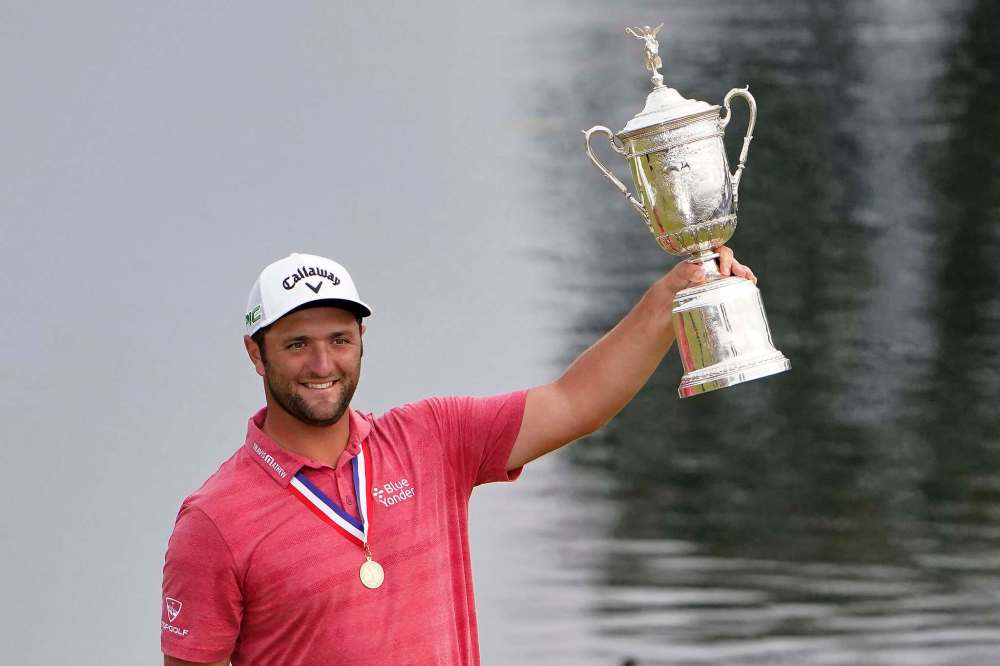 Jae C. Hong / The Associated Press
Jon Rahm, of Spain, holds the champions trophy after the final round of the U.S. Open Golf Championship, Sunday.