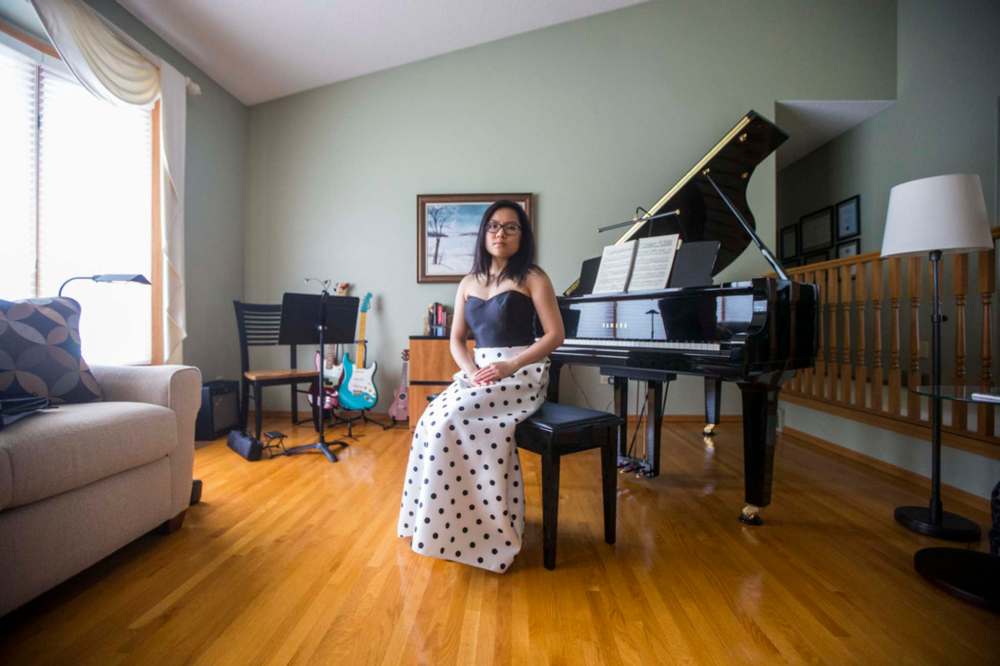 MIKAELA MACKENZIE / WINNIPEG FREE PRESS
SJR student Lauren McIlroy in one of the two dresses that she was excited to wear to grad events that have been cancelled.